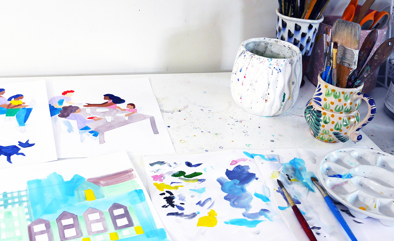 sirin-thada-desk Artist Sirin Thada's desk with paintbrushes and illustrations